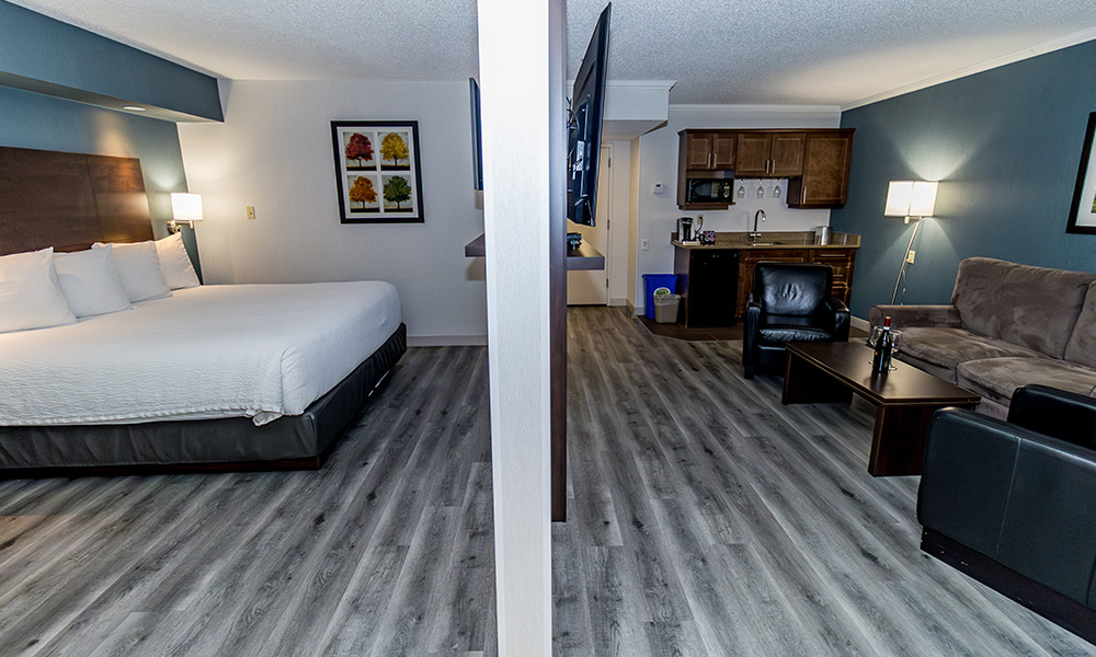 Victoria Inn Brandon hotel VIP King Suite with king bed and living room